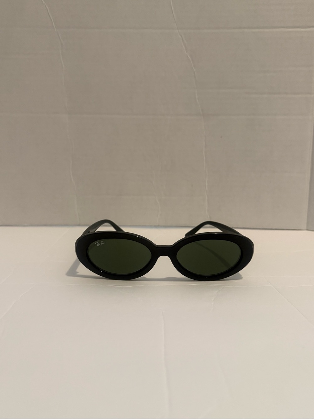 Ray-Ban RB2223 Oval Sunglasses featuring a polished black frame and green lenses